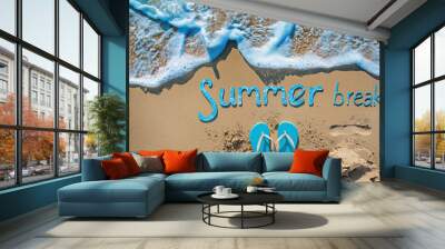 summer break concept with flip flops and sea foam on sandy beach Wall mural