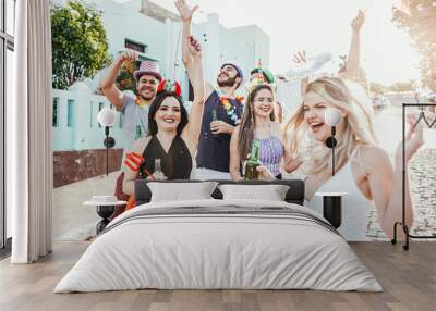 Brazilian Carnival. Group of Brazilian people in costume celebrating the carnival party in the city Wall mural