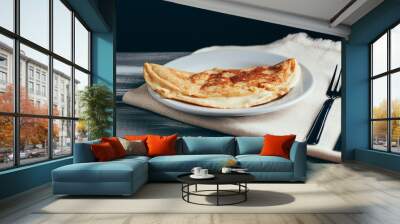 Crepioca - pancake of cassava (tapioca) with cheese on plate on wooden background. Selective focus Wall mural