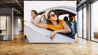 Family road trip. Latin family traveling locally by car. Wall mural