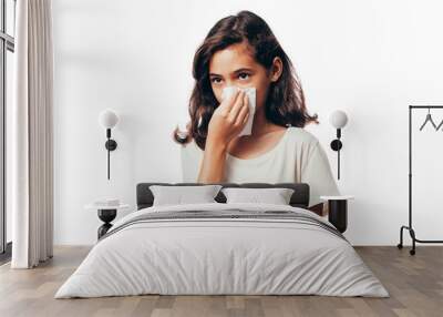 Sick little girl blowing her nose and covering it with handkerchief Wall mural