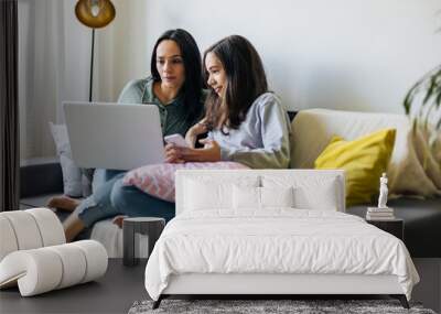 Single mother working from home with preteen daughter around Wall mural