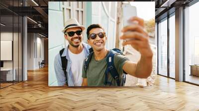 Two happy male tourists taking self portrait. Travel and love concept in Latin America Wall mural