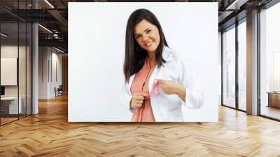 Two young women holding pink ribbon, breast cancer awareness concept Wall mural