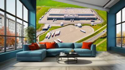 Aerial view of warehouse with trucks. Industrial background. Logistics from above.  Wall mural