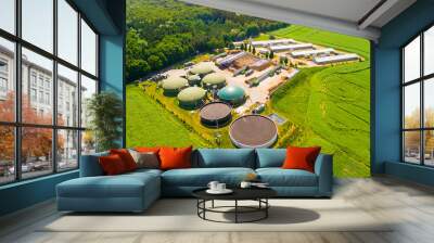 Aerial view over biogas plant and farm in green fields. Renewable energy from biomass. Modern agriculture in Czech Republic and European Union.  Wall mural