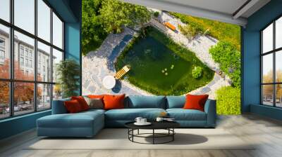 Garden pond. Relaxation zone with fish farming in an organic orchard from above. Sustainable development in gardening and aquaculture. Wall mural