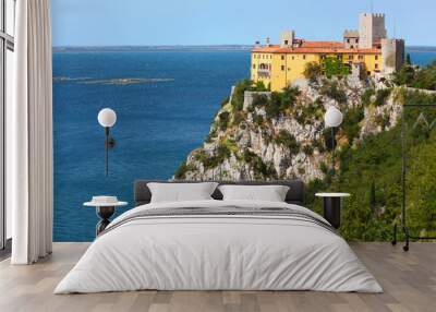 Gothic Duino castle on a cliff over the Gulf of Trieste , Italy. Wall mural