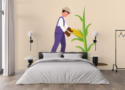 Happy Farmer man harvesting corn. Agriculture concept. Colored flat graphic vector illustration.  Wall mural