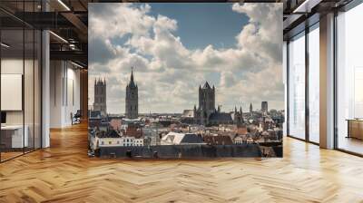 Gent, Flanders, Belgium -  June 21, 2019: Shot from castle tower, view over city roofs shows six most important and historic towers of Belfry, churches, Postal service, and university, under white clo Wall mural