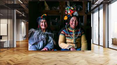 Portrait of women in typical tibetan clothes inside their house in Ladakh, Kashmir, India. Wall mural