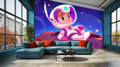 Cute astronaut kid lying on alien planet. Vector cartoon illustration of little boy in spacesuit and helmet exploring moon landscape with craters, many stars glowing in night sky, space mission Wall mural