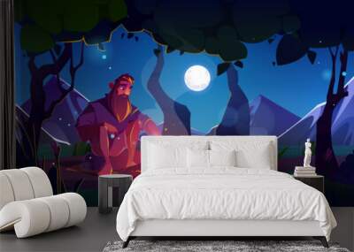 Man in forest at night near fire on meadow vector landscape. Full moon and star in dark sky outdoor environment illustration. tourist lost alone in paradise valley location painting travel scene Wall mural