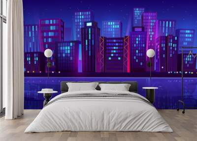 Modern night city near river glowing with colorful neon lights under midnight sky with many stars. Cartoon vector illustration of urban landscape with skyscraper silhouettes reflecting in water Wall mural