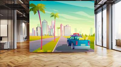 Summer travel by car. Vector cartoon illustration of auto with luggage on road to tropical city with skyscrapers and palm trees. Concept of vacation, trip by car to resort Wall mural