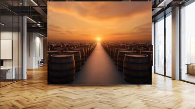 Rows of oil barrels stretch into horizon under vibrant sunset, creating dramatic and industrial scene. warm colors of sky contrast with dark barrels, highlighting vastness Wall mural