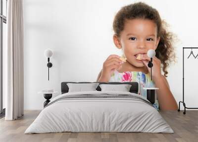 cute small girl eating a cookie Wall mural