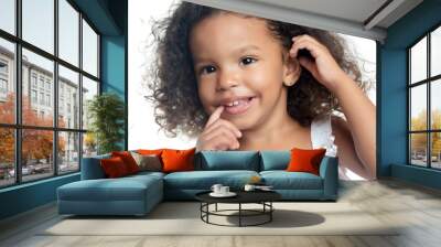 Lttle girl with an afro hairstyle with her arms extended Wall mural