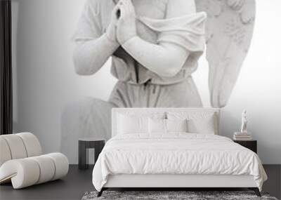 Statue of a child angel praying isolated on white Wall mural