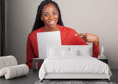 African American woman with blue eyes holding a sign with room for copy. Wall mural