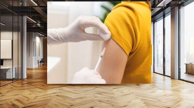 Health care, corona virus, hand of woman nurse, doctor giving syringe vaccine, injection dose on arm sick patient at clinic. Vaccination, immunization disease prevention against flu pandemic influenza Wall mural