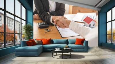 Real estate, success deal asian young woman handshake or shaking hand with landlord realtor, client male after buyer man signed rental, lease contract. Banker agreement mortgage loan, property lease. Wall mural