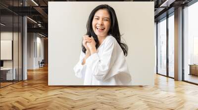 Smile positive, happy asian young woman wearing casual shirt, portrait of beautiful female with black long hair feeling prond, standing gesture cheerful looking at camera, isolated on white background Wall mural