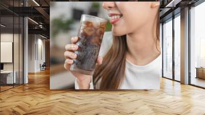 Thirsty, attractive asian young woman, girl drink or sip, holding a glass of cold sparkling water with ice in hand, refreshness people, isolated on white background. Temptation of food, health care. Wall mural