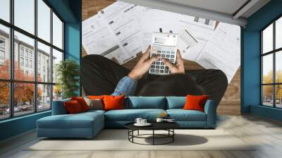 Top view man sitting on the floor stressed and confused by calculate expense from invoice or bill, have no money to pay thinking of taking the house to mortgage causing debt, bankruptcy concept. Wall mural