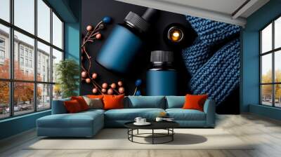 Blue Serenity: A soothing and minimalist arrangement featuring two sleek, cobalt blue dropper bottles nestled amidst a cozy blue knitted fabric and delicate copper-toned branches. Wall mural