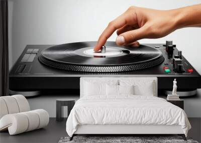 Hand on Vinyl: A close-up shot of a hand delicately adjusting a vinyl record on a sleek, black turntable. The image evokes a sense of musical artistry and precision. Wall mural