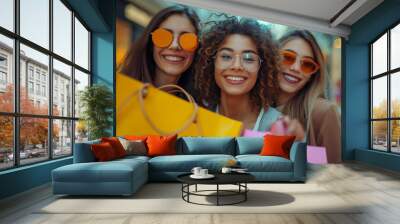 Smiling a group of woman happily holds shopping bags, showcasing her joyous retail therapy in a fashion-focused store Wall mural