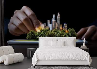 Sustainable Cityscape: Hands gently place a miniature, illuminated city model onto a tablet, symbolizing urban planning, green technology, and sustainable development. Wall mural