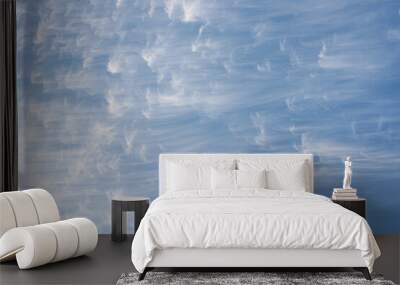 Peaceful wispy white clouds against a clean blue sky as a nature background
 Wall mural