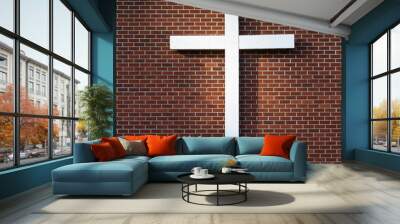 Simple white wooden cross on an exterior red brick wall, sunbeam on the wall
 Wall mural