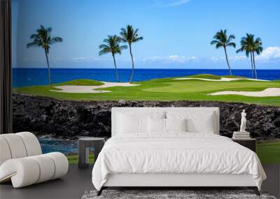 Sunny day on a tropical golf course fairway with the putting green in the distance surrounded by palm trees and sand traps, lava rock, blue pacific ocean, and blue sky and white clouds in background Wall mural