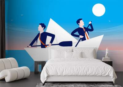 Business employees going in opposite direction. Businessmen rowing different direction in paper boat. Confusion and lack of leadership concept. Wall mural