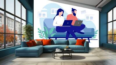 Couple working in sofa - Man and woman sitting with computers doing work at home. Flat design vector illustration with white background Wall mural