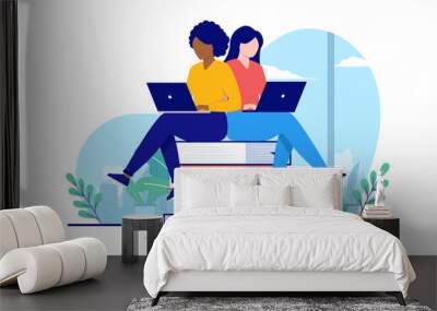 Woman education - Two female characters sitting on books working on laptops studying together. School and education concept, flat design vector illustration with white background Wall mural