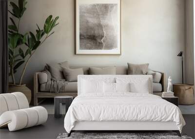 Grey sofa near beige stucco wall and big poster frame on it. Boho, rustic interior design of modern living room. Wall mural