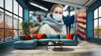 Woman shopping in supermarket (shallow DOF; color toned image) Wall mural