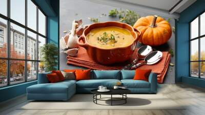 Pumpkin soup with thyme and pumpkin seeds on black background Wall mural