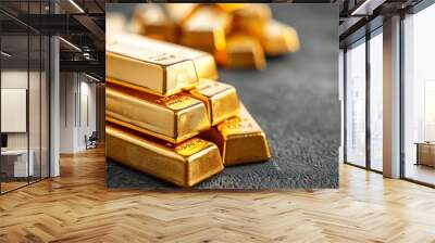 Stack of shiny gold bars on a dark textured surface, representing wealth, investment, and financial security. Perfect for economic and financial themes. Wall mural