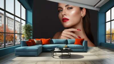 Beautiful girl with a classic make-up and red nails. Manicure design. Beauty face. Wall mural