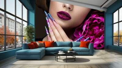 Beautiful girl with colorful make-up, flowers, retro hairstyle and long nails. Manicure design. The beauty of the face. Wall mural