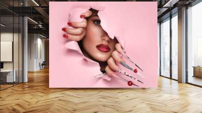 Portrait of a beautiful woman with art make up in glamorous style, creative long nails. Design manicure. Beauty face. Wall mural