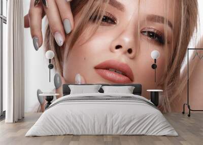 Pretty girl with easy hairstyle, classic makeup, nude lips and manicure design. Beauty face. Art nails. Wall mural