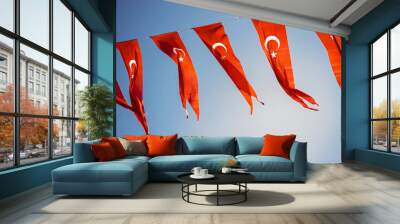 Turkish national flags with white star and moon in sky Wall mural