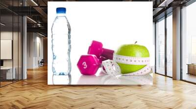 dumbbells, apple, measure tape and bootle of water Wall mural