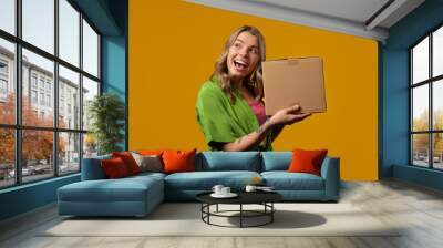 Excited smiling woman, online shopping consumer received cardboard order parcel box, desired purchase. Home courier delivery service. Sale, discounts Wall mural